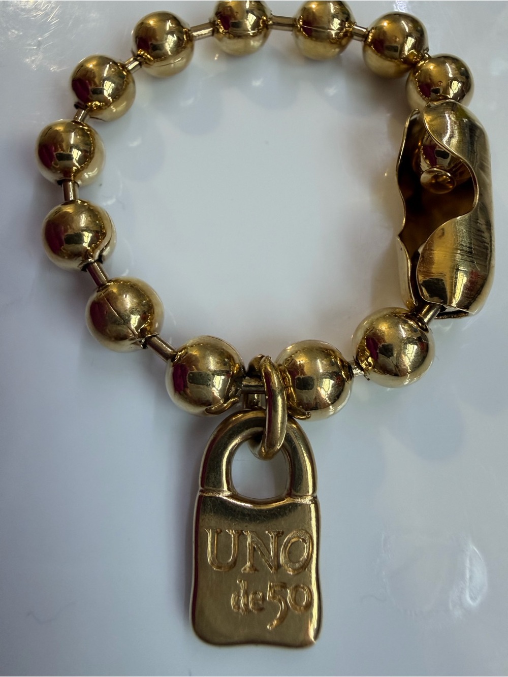 UNO de 50 Gold-Tone Beaded Bracelet with Padlock Charm